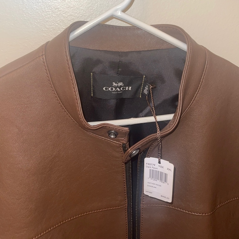 Purchased at the Coach store for $1000. Never worn (because I live in Florida)